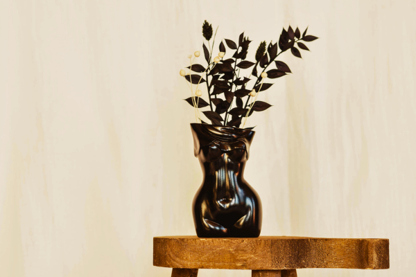 black ruscus dried flower display in body shaped vase