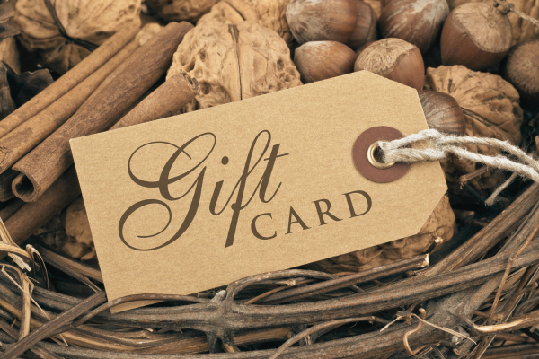 a beige color gift card for dried flower shop with straw string