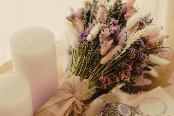 a dried flower bouquet in multiple colors including pink, purple, white and green