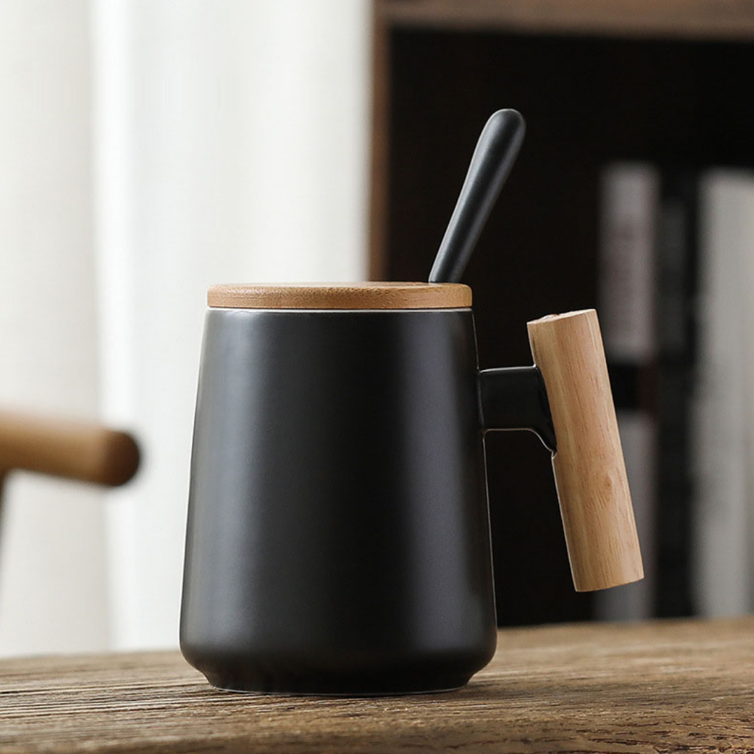 Black tea cup, coffee mug with a spoon and wood holder